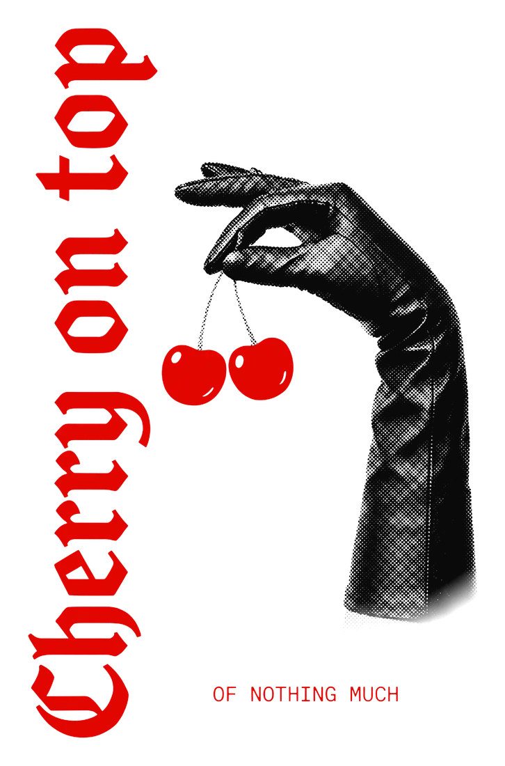 Black gloved hand dangling two red cherries